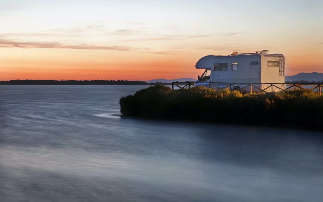 RV by beach at sunset