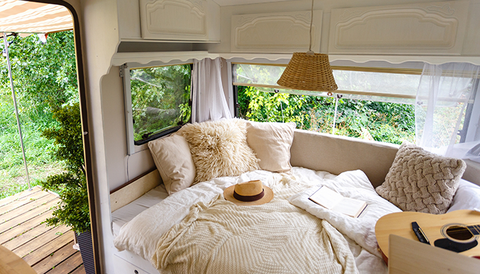 RV interior with bed and pillows